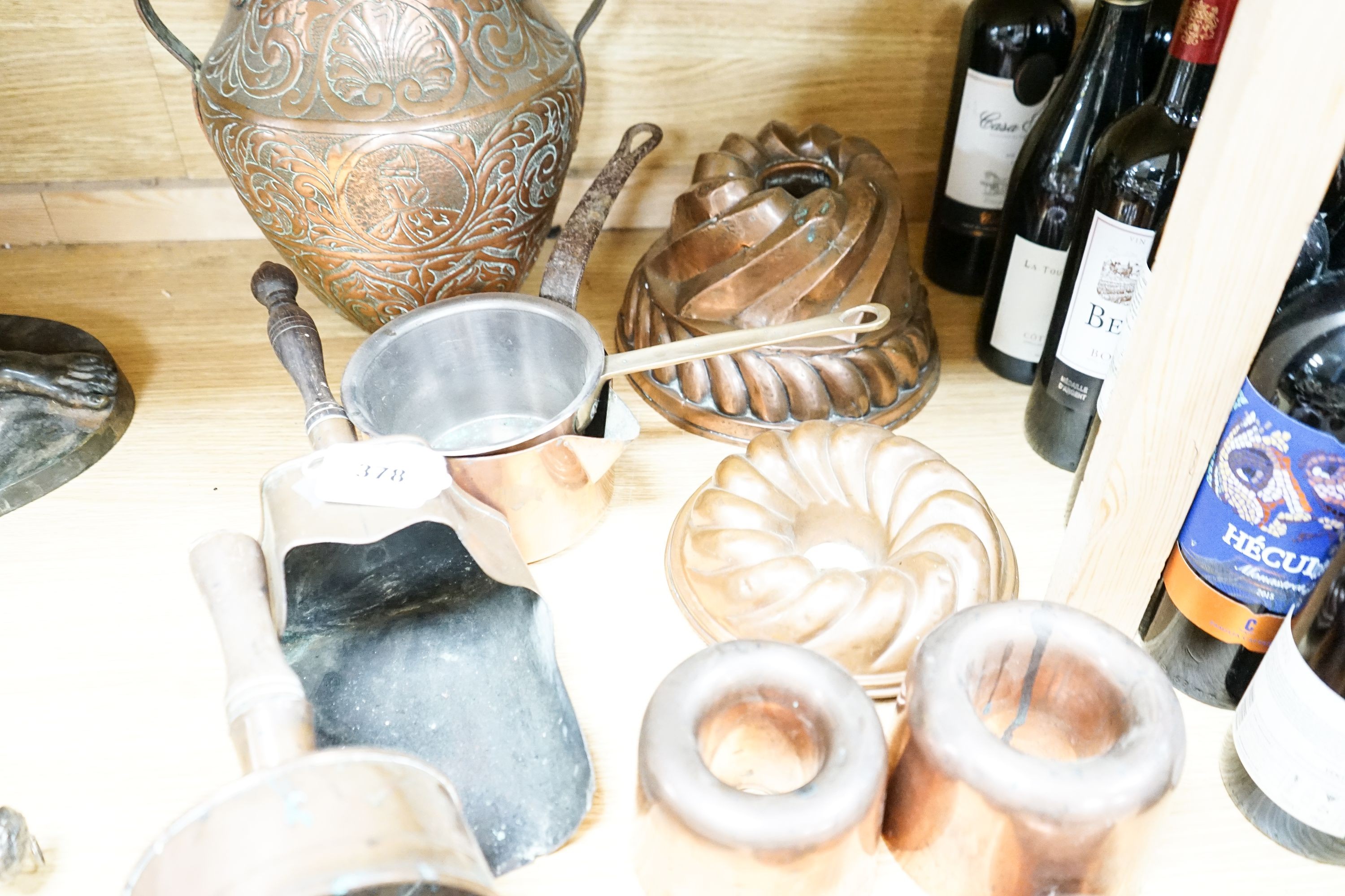 A mixed group of copper wares including Victorian jelly moulds, coal scoops, vase etc